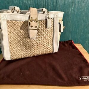 Vintage woven Coach bag with white leather trim.